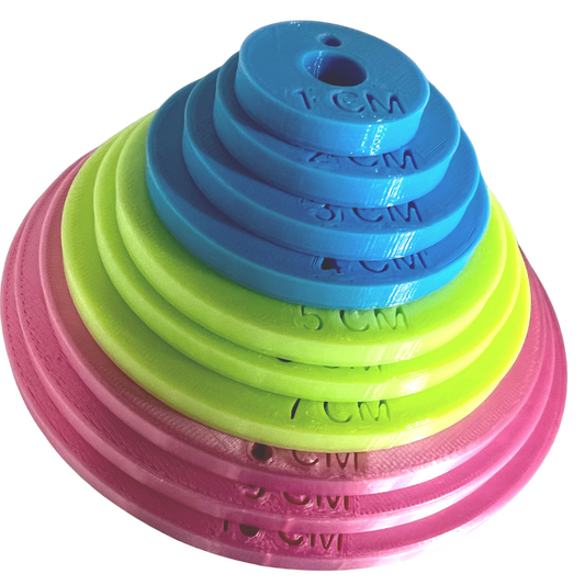 3D printed set of cervical dilation rings, colour coded to each stage of labour